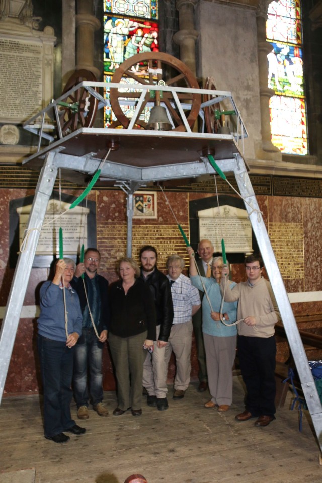 Some of the bellringers of St Fin Barre's Cathedral, Cork demonstrate their art on a miniature ring of bells set up temporarily in the north aisle of the Cathedral.
