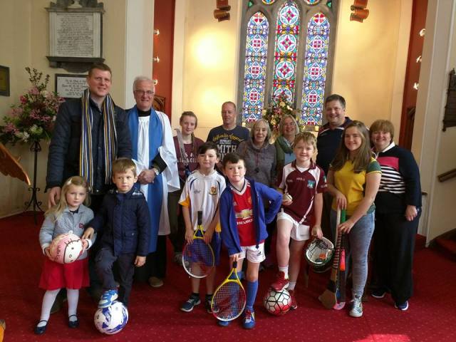 Diocesan Lay Reader, Richard Dring, from Carrigaline Union of Parishes, who presided at the recent All Age SPorts Service, surrounded by adults and young people who took part.