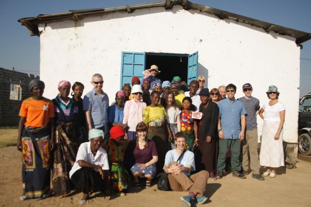 The team visiting Zambia meet with a local Women's Empowerment Grouop
